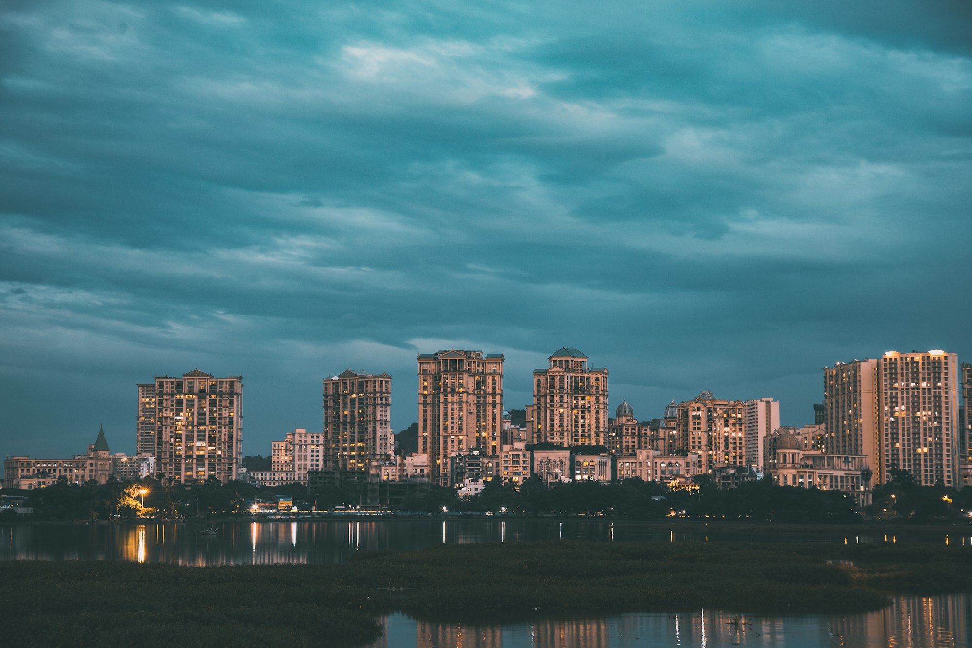 Mumbai skyline at dusk, seen across the water